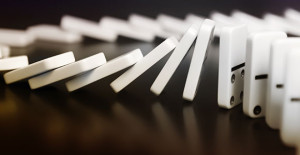 Dominoes lined up and falling