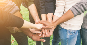 Multiracial Group of Friends with Hands in Stack, Teamwork