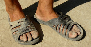 Picture of dirty sandaled feet