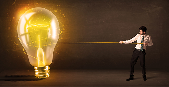 a man lassoing a light bulb