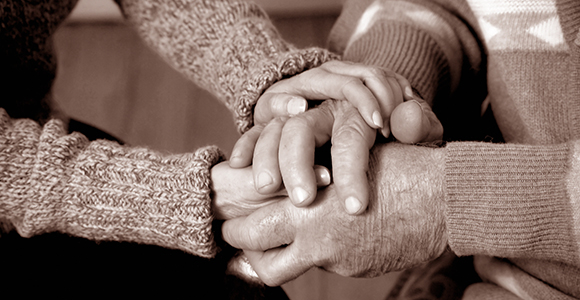black and white image of hands united