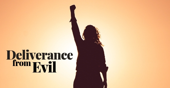 Silhouette of woman with upraised fist.