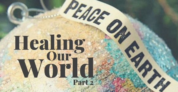 Christmas ornament of earth with ribbon that says, "Peace on earth."