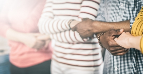hands held in community