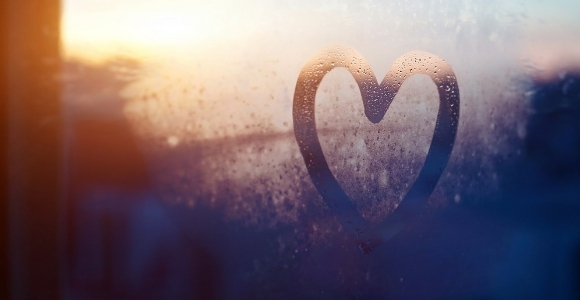 heart drawn on foggy window