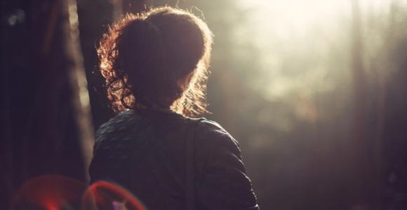 woman looking into the sun